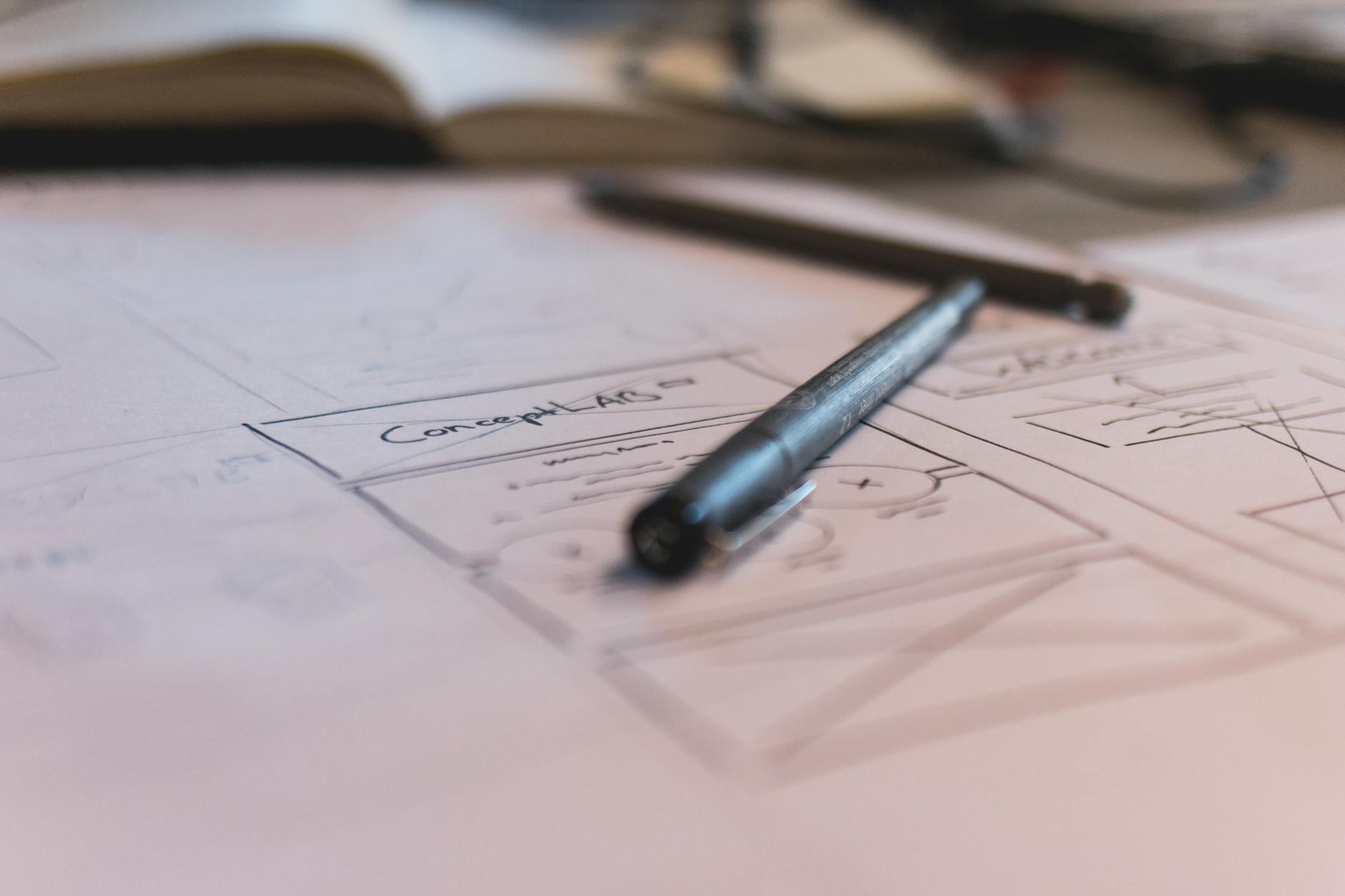 A storyboard on a white paper and a pen